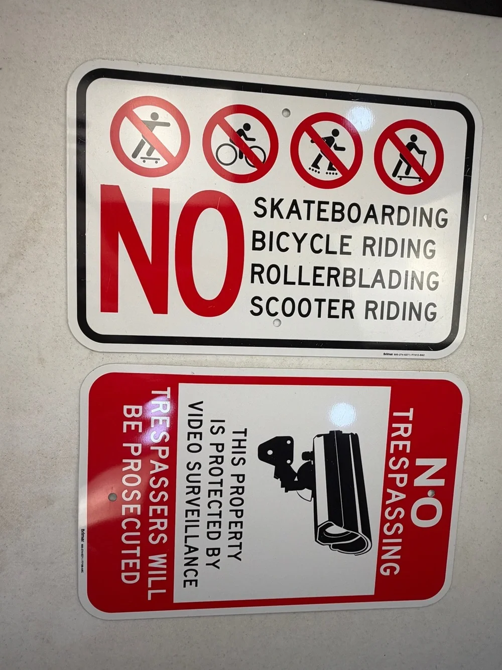 No Skateboarding & No Trespassing Red and White Warning Signs